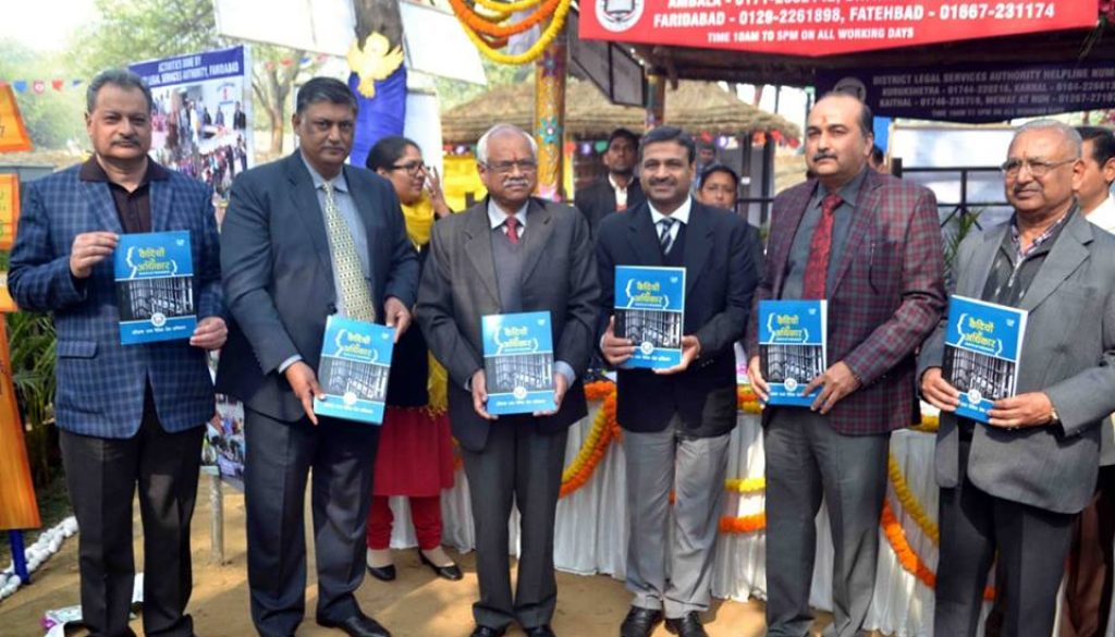 <center>Students from Faculty of Law are guiding visitors about e-courts at the Suraj kund Crafts Mela 2019
